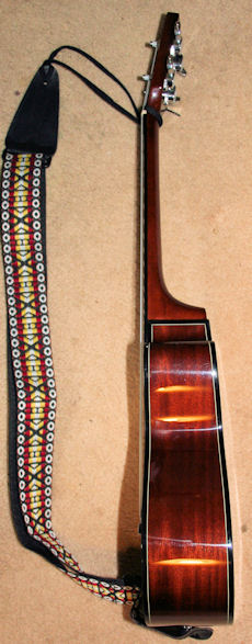 Kala with guitar strap